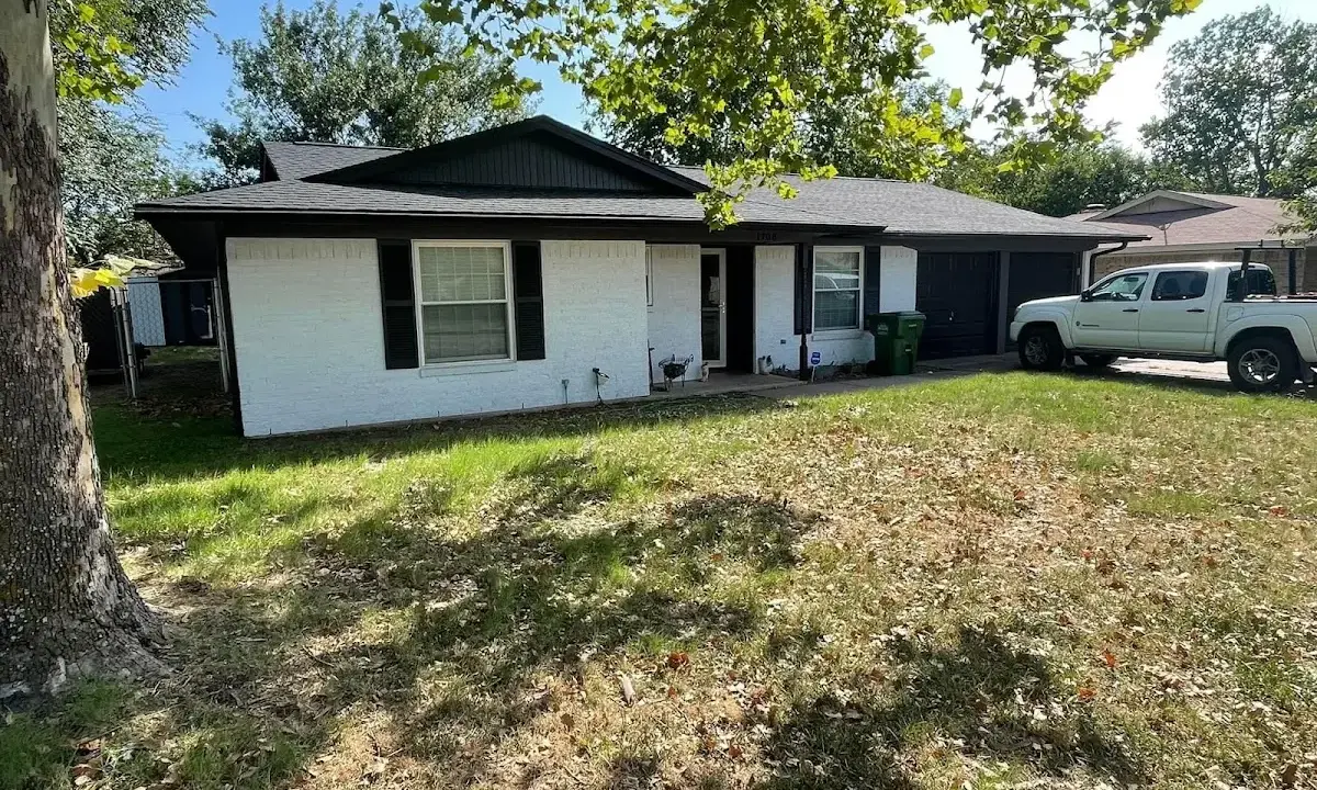 Professional roofing crew working on a residential roof in Fairfield Plantation